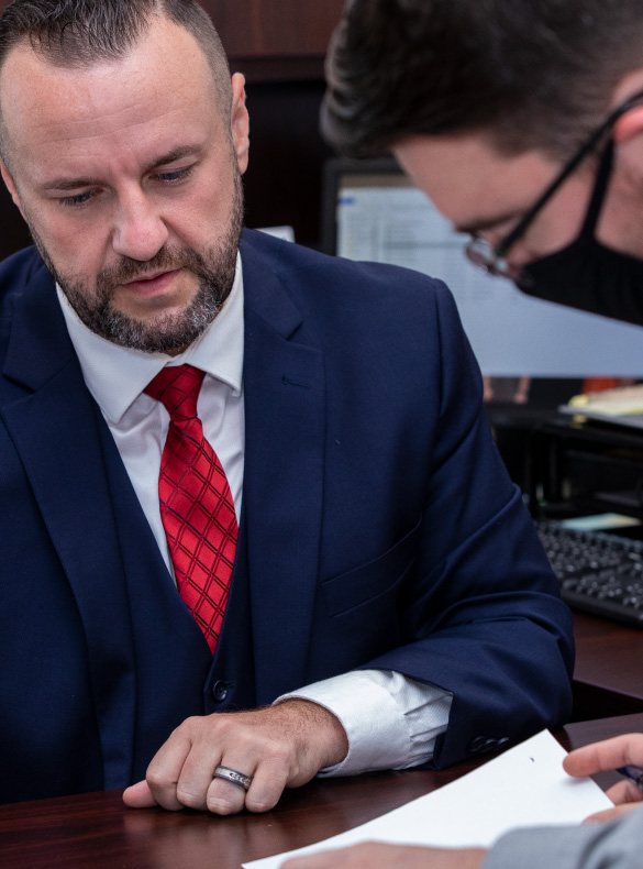 men reviewing paperwork